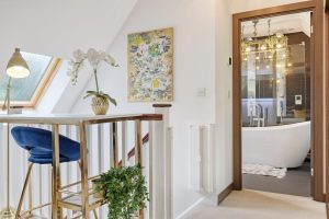 Landing with skylight and view into an ensuite bathroom