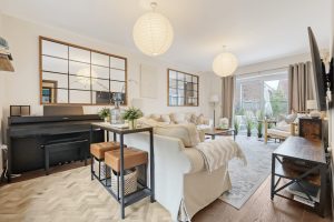 Open-plan living room with piano and pendant lights