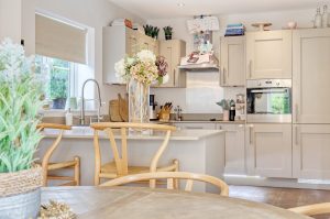 Kitchen with shaker units and dining table