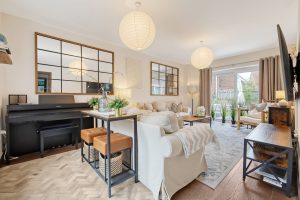 Open-plan living room with piano and garden doors