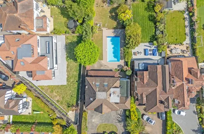 Top-down drone photo of house roofs for a roof and asset check